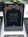 Decorative card with a quote on a black stand