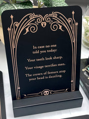 Decorative sign with text on a stand