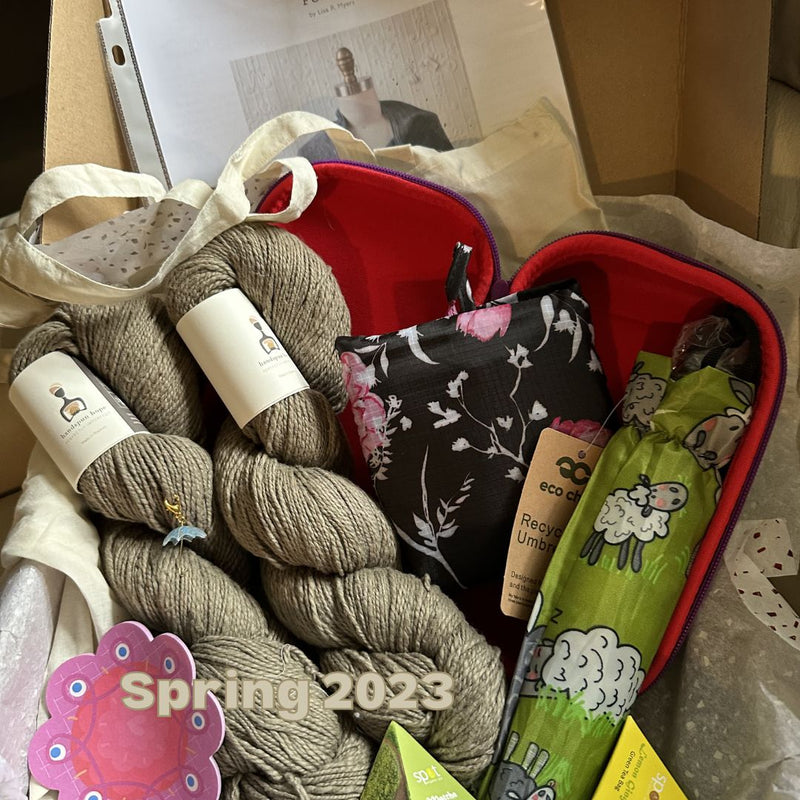 Yarn and craft supplies in a box with 'Spring 2023' text.