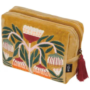 Mustard yellow pouch with floral design and tassel on a white background